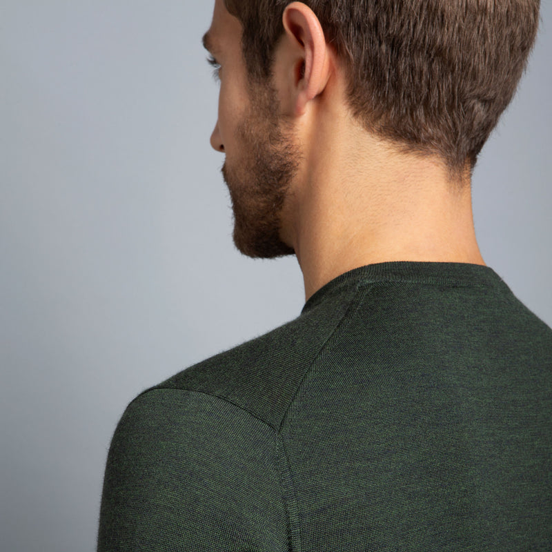 Extra Fine Merino Wool Crewneck in Dark Green, detail of shoulder on model – FILOFINO Luxury Italian Knitwear