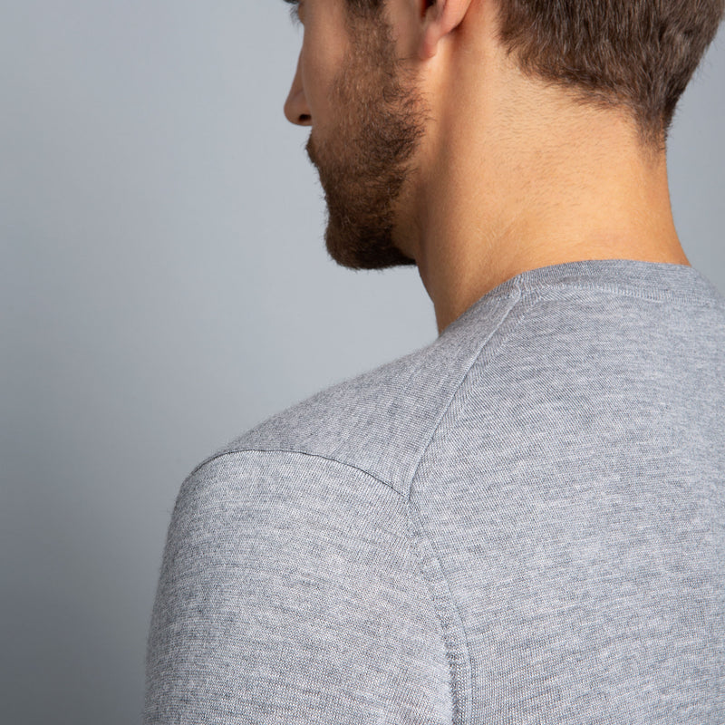 Extra Fine Merino Wool Crewneck in Light Grey, detail of shoulder on model – FILOFINO Luxury Italian Knitwear