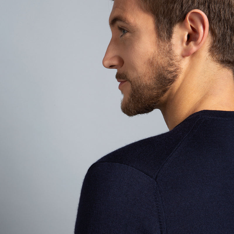 Extra Fine Merino Wool Crewneck in Navy, detail of shoulder on model – FILOFINO Luxury Italian Knitwear