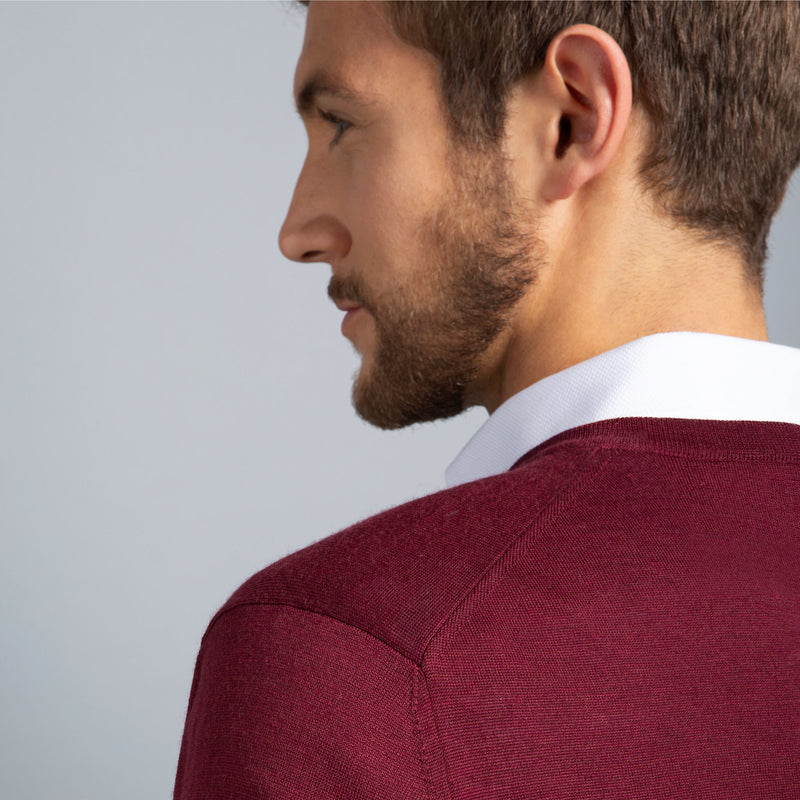 Extra Fine Merino Wool V-Neck in Burgundy Red, detail of shoulder on model – FILOFINO Luxury Italian Knitwear