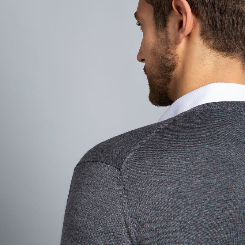 Extra Fine Merino Wool V-Neck in Charcoal, detail of shoulder on model – FILOFINO Luxury Italian Knitwear